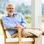 a-photo-of-a-smiling-man-in-a-chair-outs