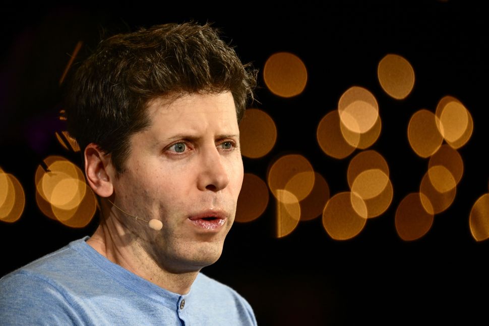 Man in blue shirt with wraparound microphone