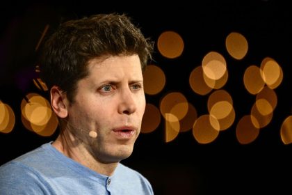 Man in blue shirt with wraparound microphone