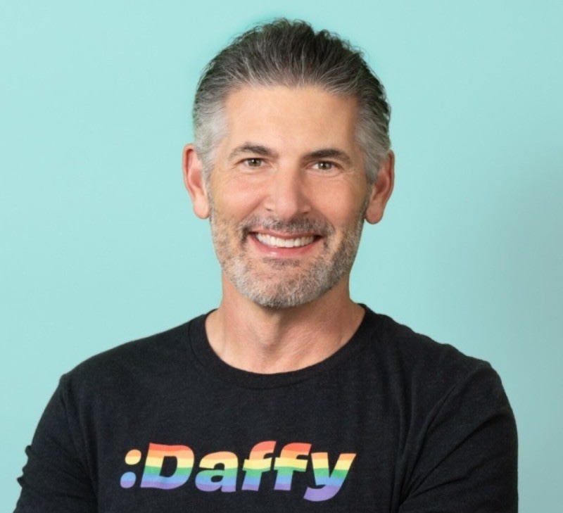 Man wearing black t-shirt that reads 'Daffy' in rainbow coloring