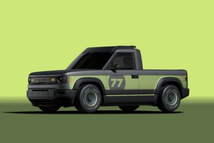 Green and grey pickup truck pictured against green background